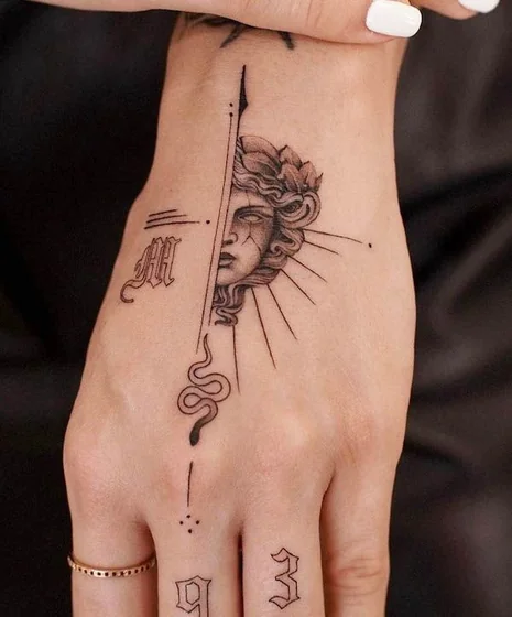 Fine Line Medusa, Snake & Gothic Lettering tattoo for women on hand