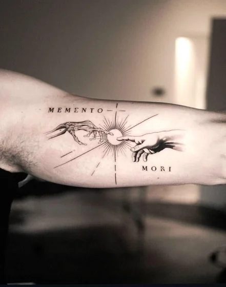 Fine Line Memento Mori tattoo design for men on Upper Arm.
