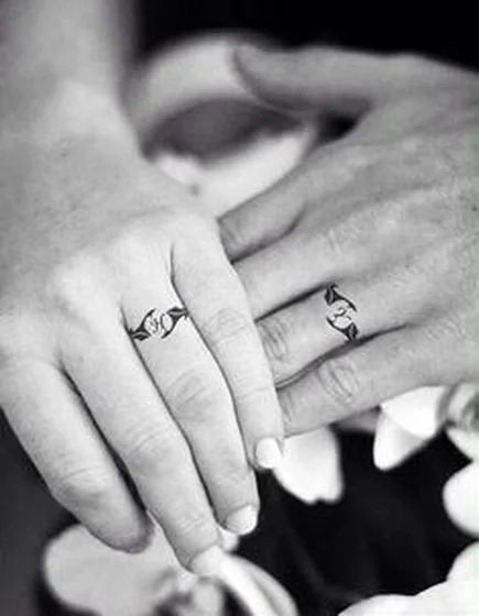 Fine Line Minimalist Heart Ring tattoo idea for men and women on finger