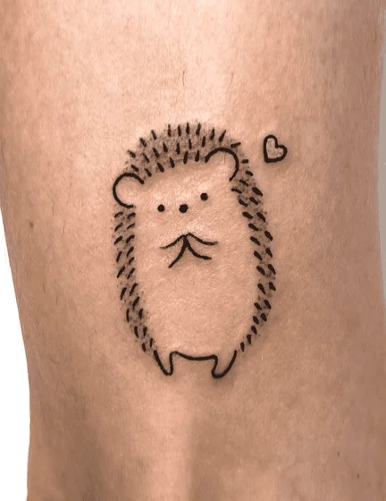 Fine Line Minimalist Hedgehog and Heart tattoo design for women on leg