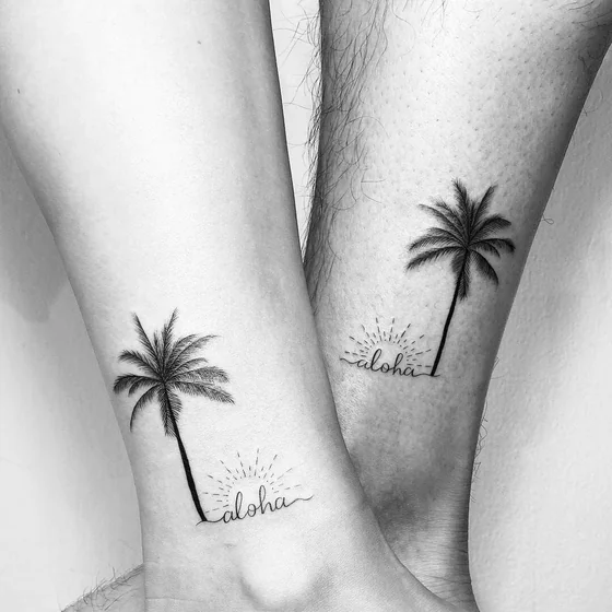 Fine Line Minimalist Palm Tree and 'Aloha' tattoo idea for couples on ankle