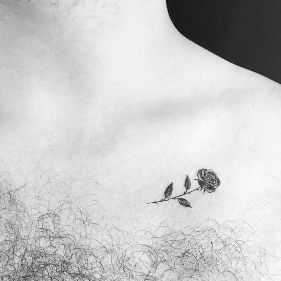 Fine Line Minimalist Rose tattoo design for men on chest