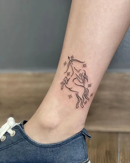 Fine Line Minimalist Sagittarius Star tattoo idea for women on Ankle