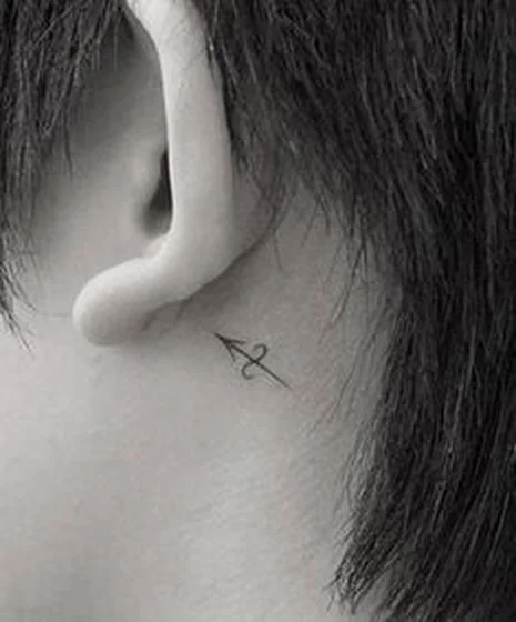 Fine Line Minimalist Sagittarius tattoo for men/women behind ear