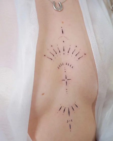 Fine Line Minimalist Sun Cross Moon tattoo design for women on rib