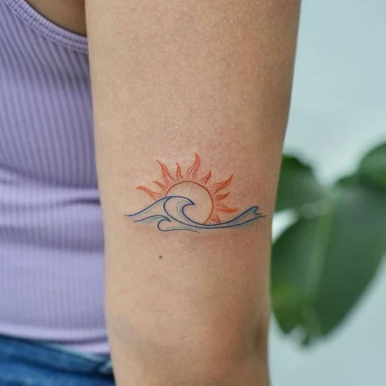 Fine Line Minimalist Sun and Ocean tattoo design for women on Upper Arm