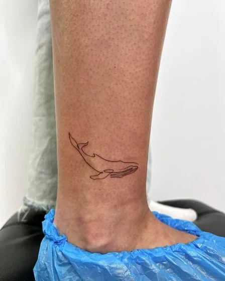 Fine Line Minimalist Whale tattoo design for men and women on ankle