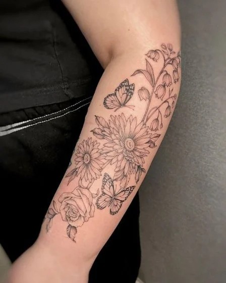 Fine Line Minimalist butterfly and floral tattoo design for women on forearm