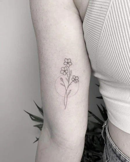 Fine Line Minimalist floral flower tattoo design for women on upper arm