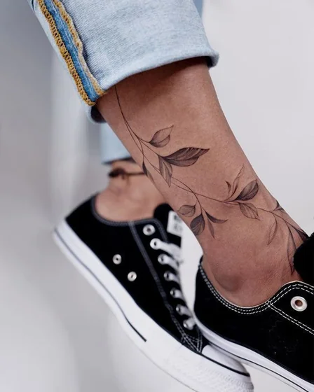 Fine Line Minimalist vine floral tattoo design for women on ankle