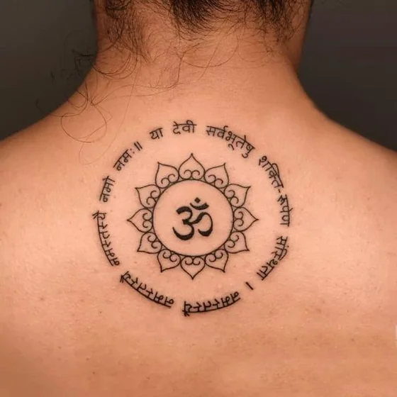 Fine Line Script Om Lotus tattoo design for women on back shoulder