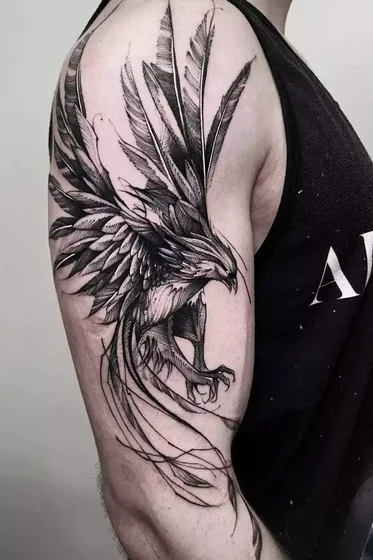 Fine Line Sketch Phoenix Wing tattoo idea for men on upper arm and shoulder