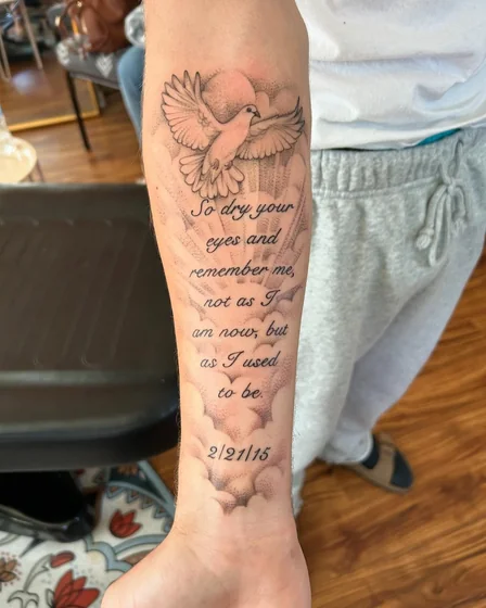 Fine Line and Script dove and quote tattoo design for men on forearm