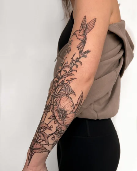 Fine Line bird and floral tattoo design for women on forearm
