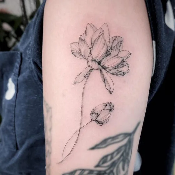Fine Line floral flower tattoo design for women on upper arm