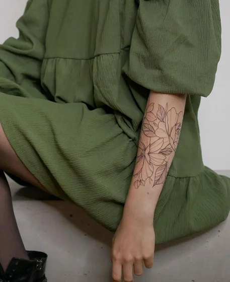 Fine Line floral linework tattoo design for women on forearm