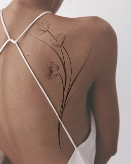 Fine Line floral tattoo design for women on back and shoulder
