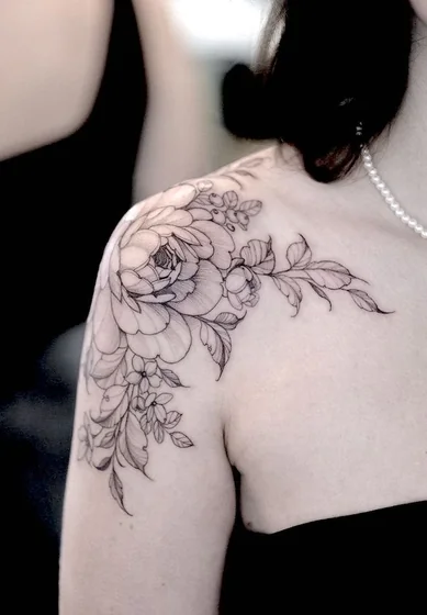 Fine Line floral tattoo design for women on shoulder and upper arm