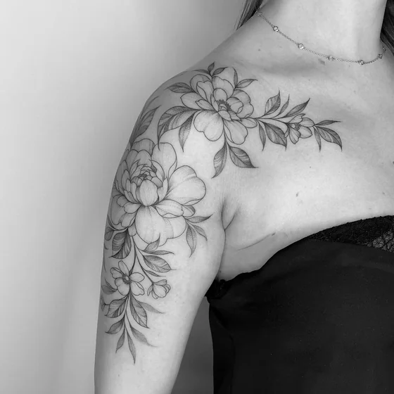 Fine Line floral tattoo design for women on shoulder and upper arm
