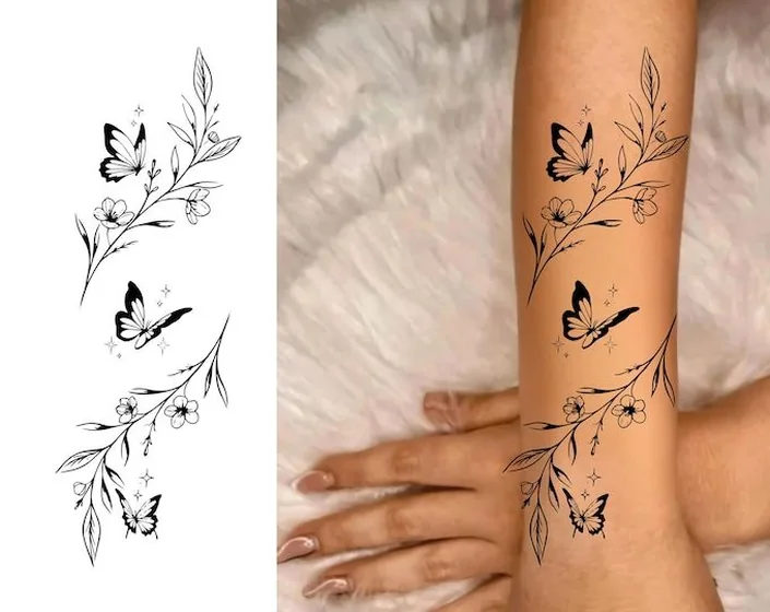 Fine Line minimalist butterfly floral vine tattoo design for women on forearm