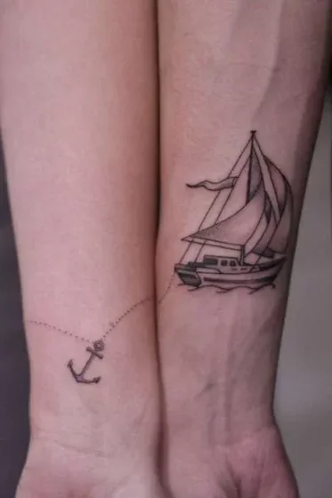 Fine Line minimalist nautical anchor and sailboat tattoo idea for men and women on wrist