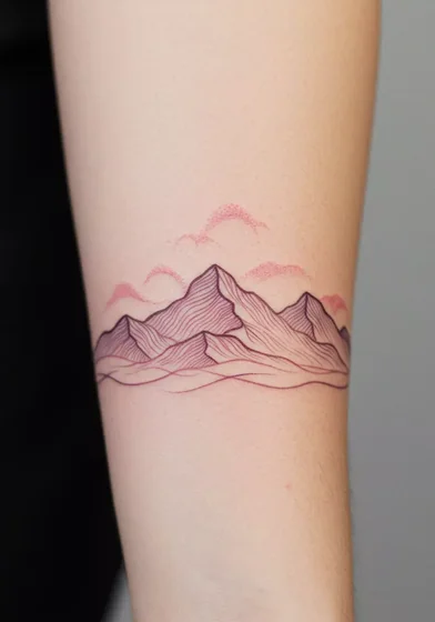 Fine Line mountain and cloud tattoo design for women on forearm