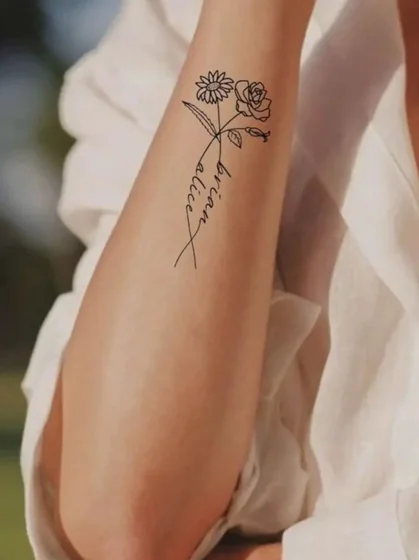 Fine Line rose, daisy, script tattoo idea for women on forearm