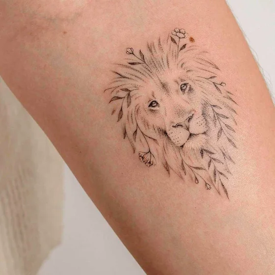 Fine Line sketch lion and floral tattoo design for women on upper arm