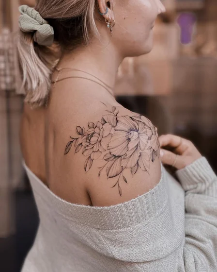 Fine line floral tattoo design for ladies on shoulder and back