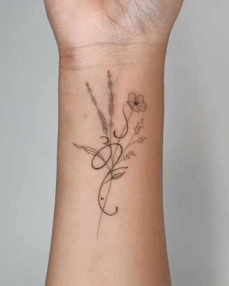 Fine line minimalist floral tattoo design for women on wrist