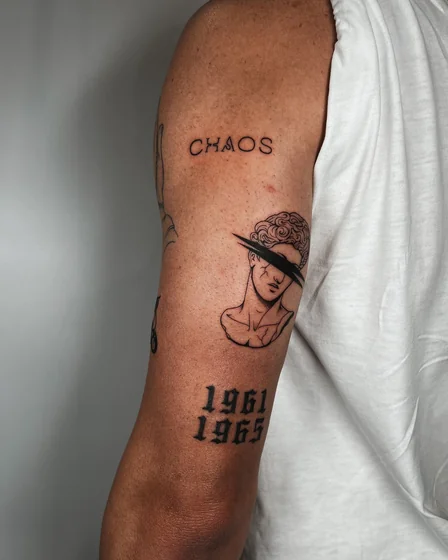 Fine line patchwork tattoo for men: word, bust, years on arm.