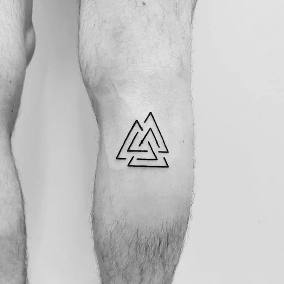 Geometric Fine Line Valknut tattoo design for men on leg near knee