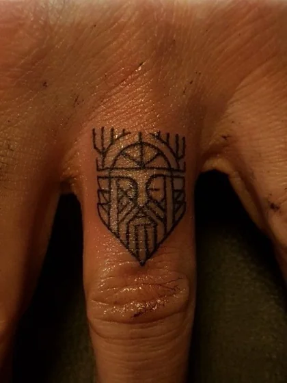 Geometric Viking crown tattoo design for men on finger