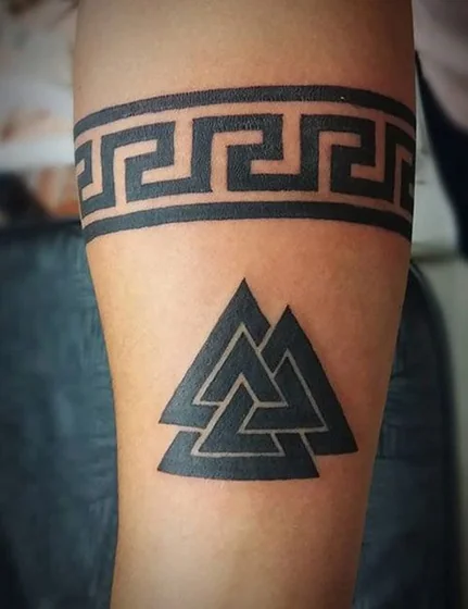 Geometric blackwork Greek Key and Valknut tattoo design for men on arm