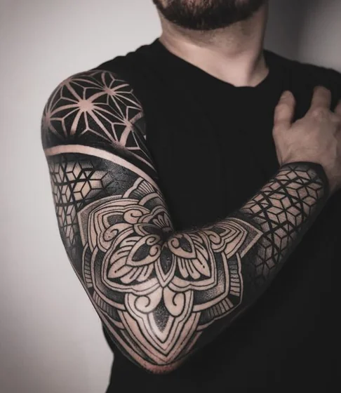 Geometric blackwork floral and star full sleeve tattoo design for men