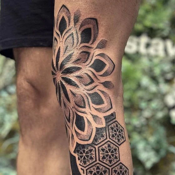 Geometric dotwork mandala floral tattoo for men on knee