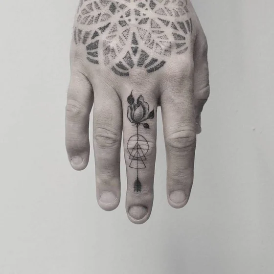 Geometric dotwork rose and mandala tattoo design for men on hand and finger