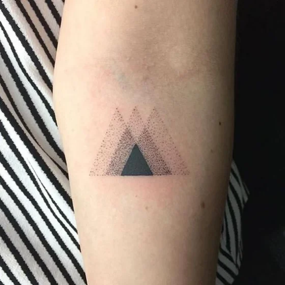 Geometric dotwork triangles tattoo design for women on forearm