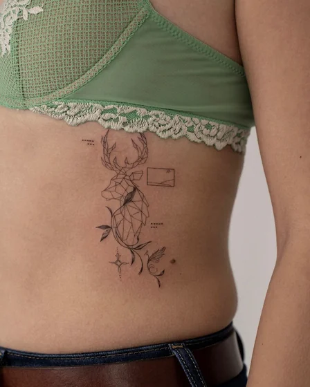 Geometric fine line deer and minimalist landscape tattoo design for women on rib