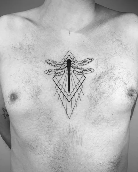 Geometric fine line dragonfly tattoo design for men on chest tattoo ideas
