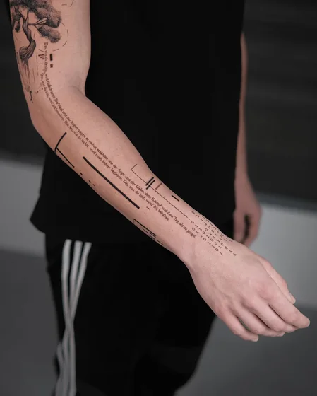 Geometric script tattoo for men with tree, quote, binary.