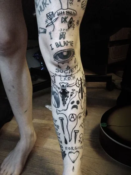 Ignorant Patchwork leg tattoo for men: roses, hearts, crying eyes, ghosts.