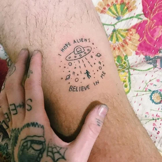 Ignorant fine line alien UFO abduction tattoo idea for men on thigh