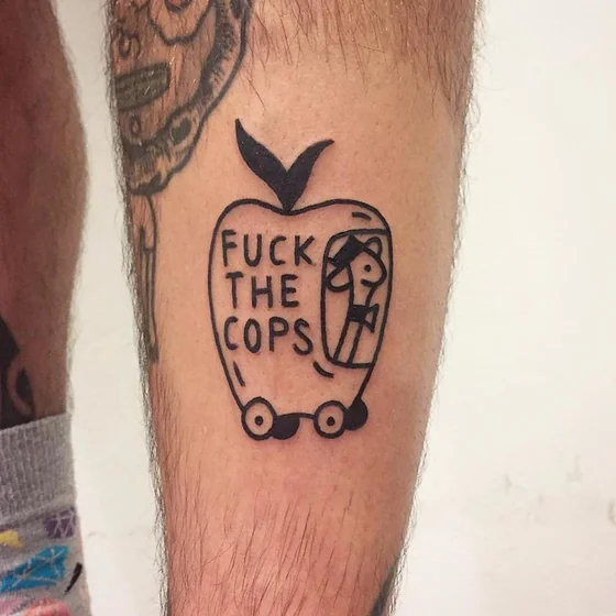 Ignorant patchwork apple protest tattoo design for men on calf