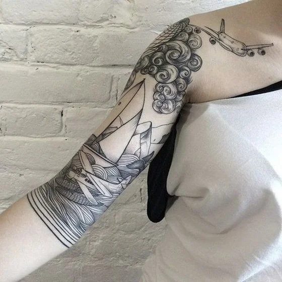 Illustrative Black And Grey Linework airplane, mountain, cloud tattoo design for women on half sleeve.