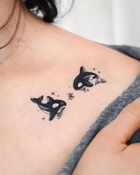 Illustrative Orca tattoo design for women on chest