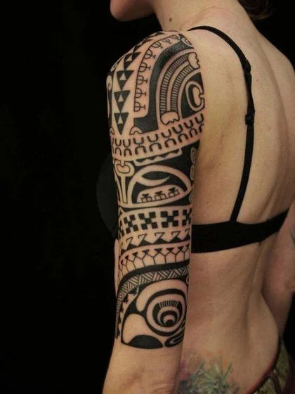 Intricate tribal blackwork tattoo design for women on half sleeve