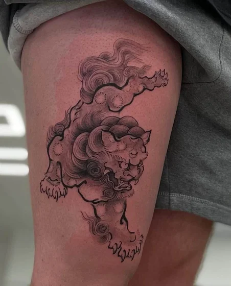 Japanese Foo Dog and Lion black and grey tattoo idea for men on thigh