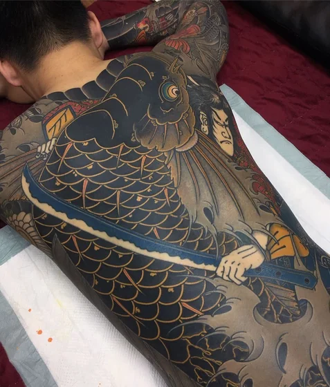 Japanese Koi Fish and Warrior tattoo idea for men on back.