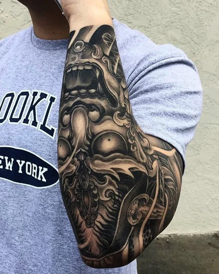 Japanese Oni Mask half sleeve tattoo design for men on forearm